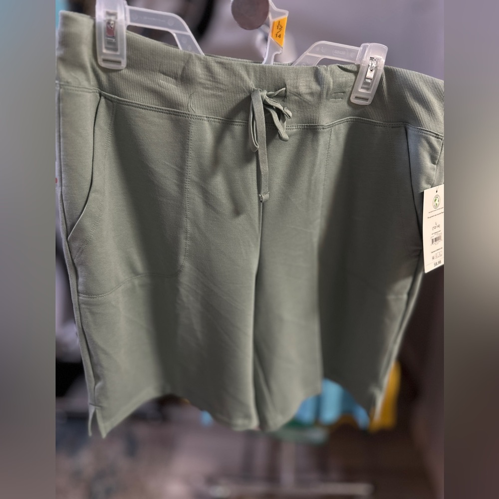 New size L green shorts w tags.